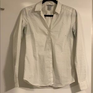 A white with black dots work shirt